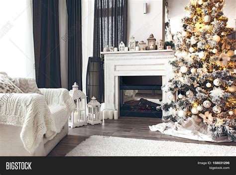 Beautiful Holiday Decorated Room With Christmas Tree Fireplace And
