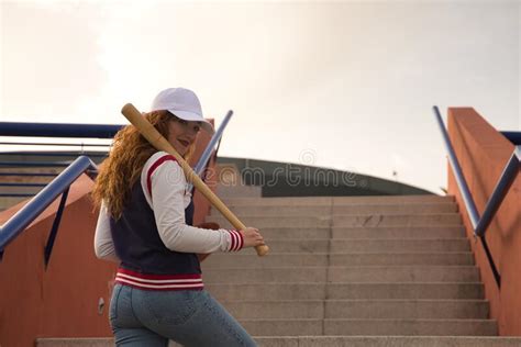 Young Attractive Red Haired Woman With Freckles Wearing A White Cap