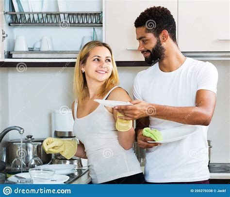 Interracial Couple Cleaning In The Kitchen Stock Photo Image Of Mixed Kitchen