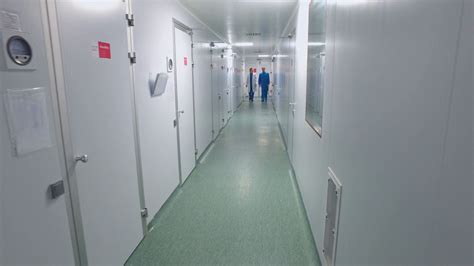 Scientists Walking Lab Corridor Pharmaceutical Workers Talking In