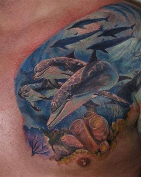 Very Realistic Looking Multicolored Dolphins Tattoo On Chest