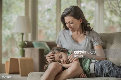 mom sits on sons lap photos and premium high res pictures getty images