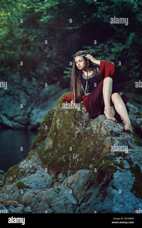 Medieval Young Lady Posing On A Stream Rock Historical And Fantasy