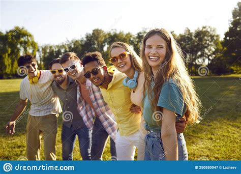 Portrait Of Happy Excited Young Woman Standing With Her Multiracial