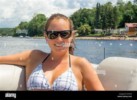 Woman Sunbathing On A Boat Stock Photo Alamy