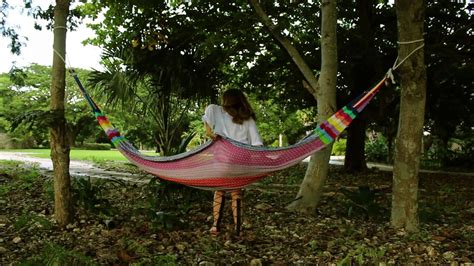 Once the tarp is slung over the. How To Hang A Hammock Between Two Trees - YouTube