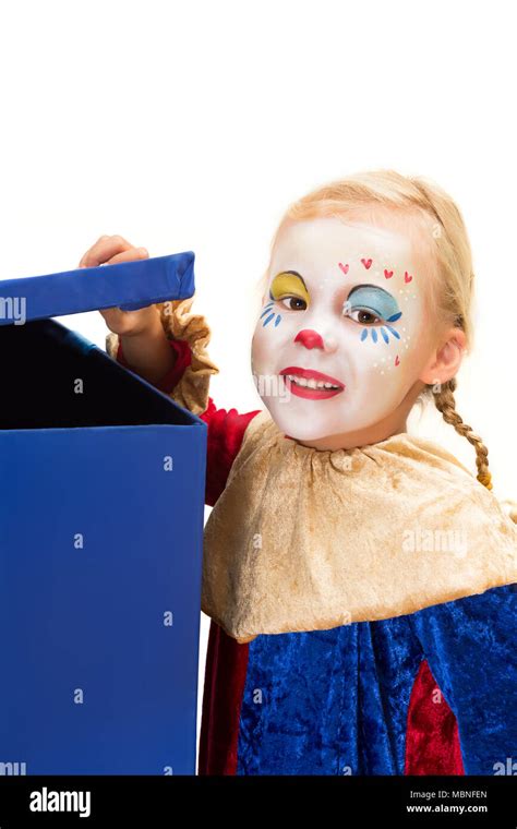 Curious Clown Girl Looking Into A Big Blue Surprise Box Stock Photo Alamy