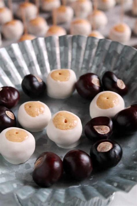 Happiness is biting into that first layer of chocolate with a surprise inside. White Chocolate Buckeyes | The Spiffy Cookie