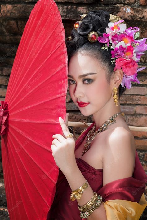 Premium Photo Beautiful Thai Girl In Traditional Dress Costume Red Umbrella As Thai Temple