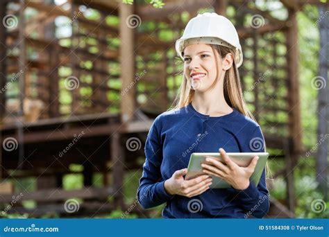 Happy Female Architect Holding Digital Tablet At Stock Photo Image Of