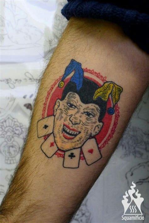 A Mans Arm With A Tattoo On It That Has An Image Of A Clown