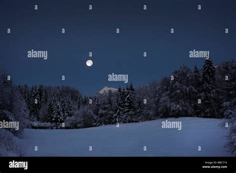 Full Moon Over Snowfield Stock Photo Alamy