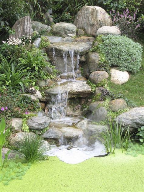 A Three Tiered Stone Waterfall That Ends In A Tiny But Deep Well The