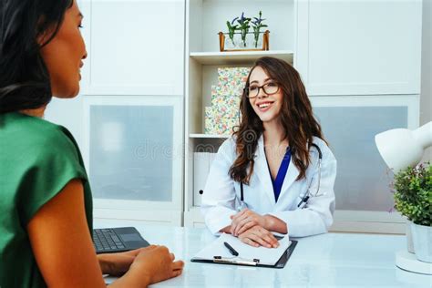 female doctor smiling with woman patient consultation clinic health checkup stock image image