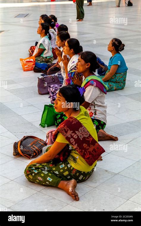 Female Visitors Praying At The Shwedagon Pagoda Yangon Myanmar Stock