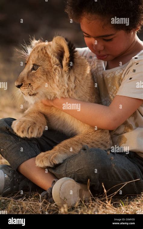 Girl Holding Lion Hi Res Stock Photography And Images Alamy
