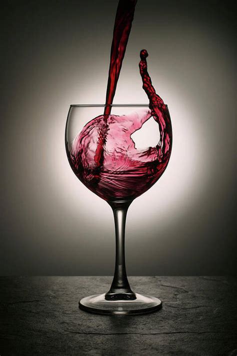 Dramatic Red Wine Splash Into Wine Glass Art Print By Donald Gruener