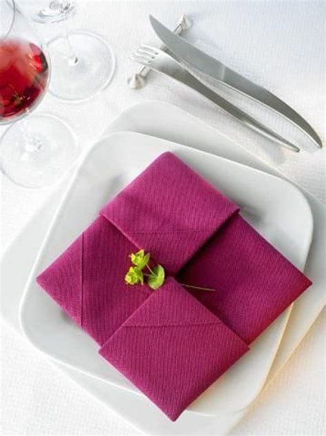 Folding paper napkins for silverware isn't as tricky as you might think and can be learned with just a few minutes of practice. Pin on Event How-To