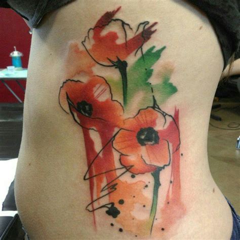 The thing on her back is a tattoo. Poppy Tattoos Designs, Ideas and Meaning | Tattoos For You