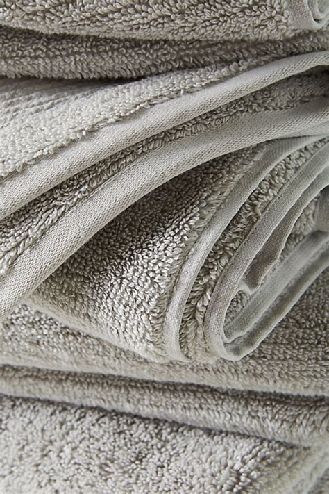 Their design is rather standard, with nothing that stands out to the eye. Kassatex Pergamon Towel Collection | Anthropologie