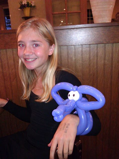 A Woman Holding An Inflatable Octopus Balloon