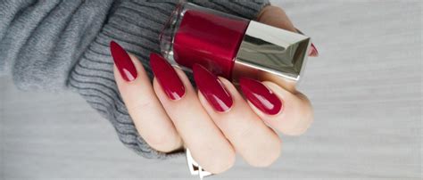A Look At The Classic Red Nails History And Modern Designs