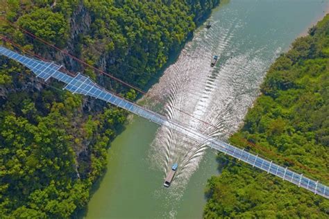 The zhangjiajie grand canyon glass bridge in china is the world's longest and highest glass bridge. Watch this Insane Footage of China's Record-Breaking Full ...