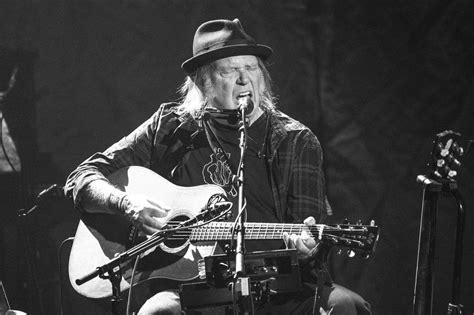 Review: Neil Young, quietly electrifying while flying solo at the Tower