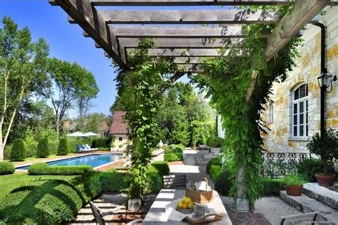 Lush French Country Backyard Garden Space Complete With Pergola Pool