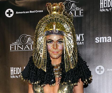 heidi klum wears cleopatra costume face jewels at haunted holiday bash couple halloween