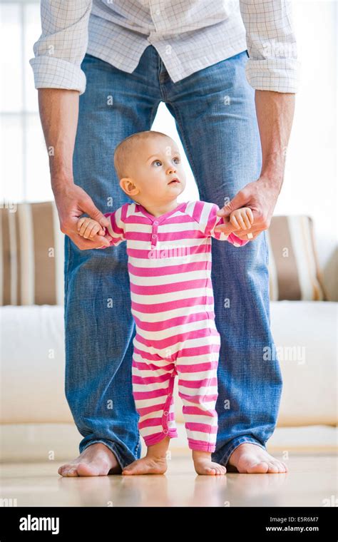 12 Month Old Baby Taking First Steps Stock Photo Alamy