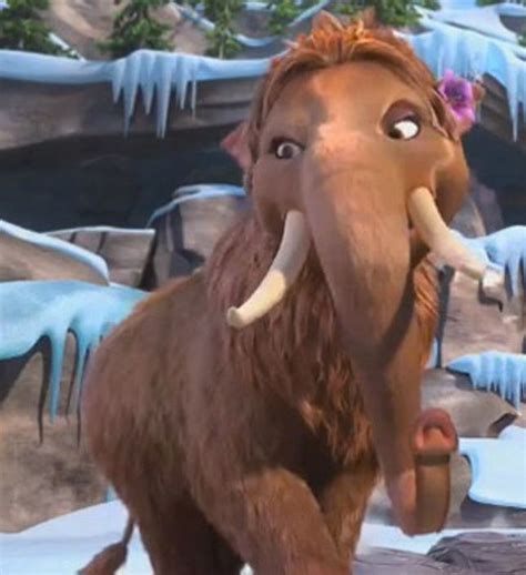 An Ice Age Mammoth Is Standing In Front Of Some Icicles And Snow Covered Rocks