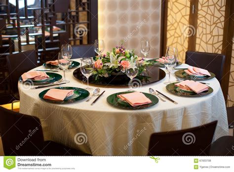 When bread and butter are served, add a butter plate to the table. Formal Table Setting With Flower Decoration Stock Photo ...