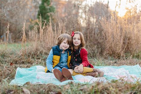 Cute Brother And Sister Sitting Together On A Blanket By Stocksy Contributor Jakob Lagerstedt