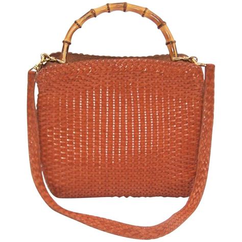 This italian woven leather purse is the classic tote in a striking pattern. C.1990 Gucci Cognac Woven Leather Handbag With Bamboo ...