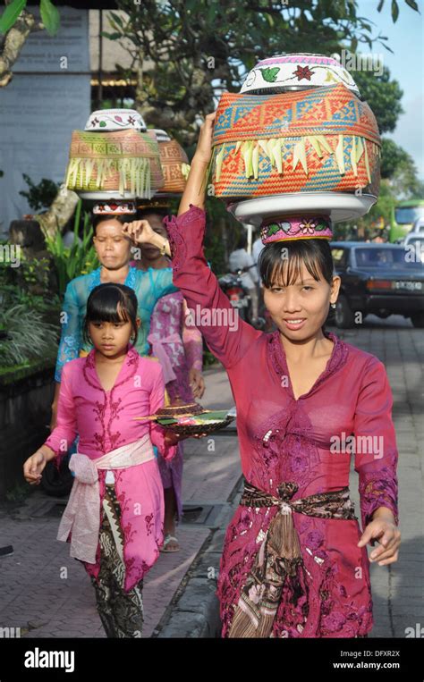 Ubud Bali Indonesia Women In Traditional Dress Carrying A Basket