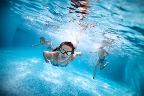 Kids Swimming Underwater In Pool Stock Photo Download Image Now Istock