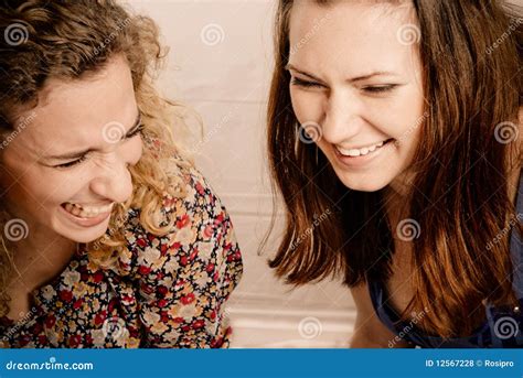 Two Girl Friends Laughing Gleefully Stock Photo Image Of Headshots