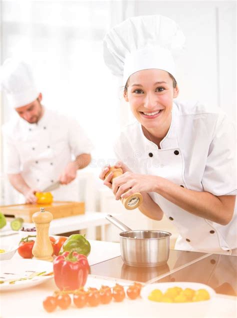Young Attractive Professional Chef Cooking In His Kitchen Stock Photo