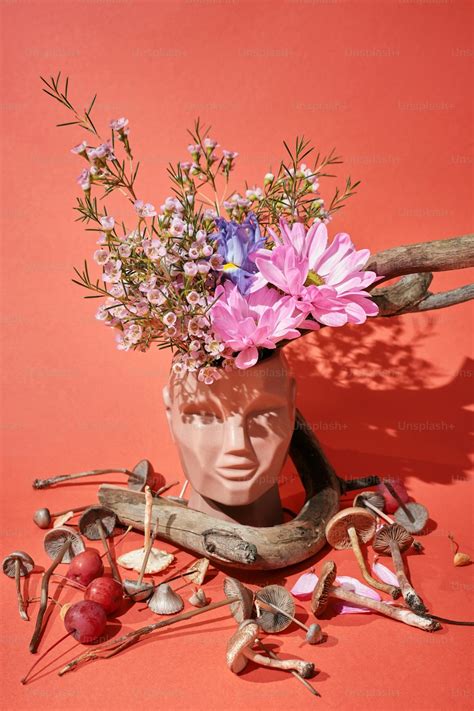 A Vase Filled With Flowers Sitting On Top Of A Table Photo Remedy