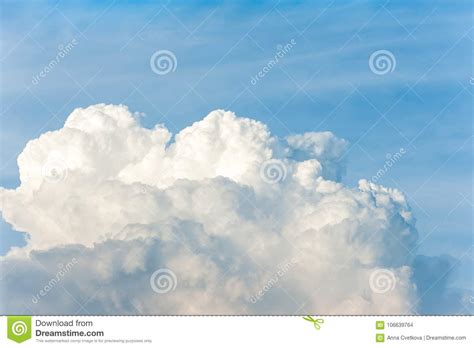 White Cumulus Congestus Clouds On Blue Sky Background Stock Photo