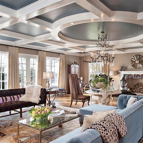 Large kitchen featuring a nicely set breakfast bar lighted by pendant lights hanging from the coffered ceiling. Gorgeous coffered ceiling using traditional white and ...