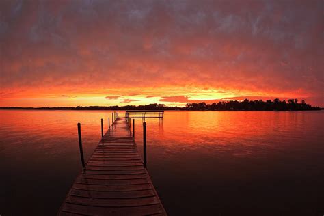 Dock At Sunset On Lake Minnetonkamn By Alvis Upitis