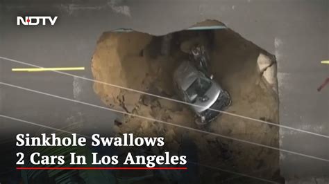 Sinkhole Swallows Cars In Los Angeles In Massive Storm Youtube