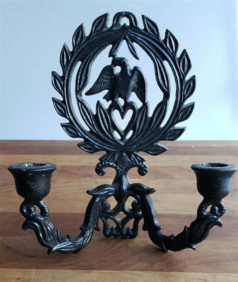 Safavieh amelia wall sconce tea light candle holder in black. Vintage black cast iron eagle heart and wreath wall candle ...