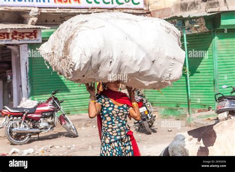 jodhpur india october 23 2012 indian woman carries heavy load on her head in jodhpur india