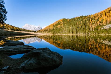 Reflections On Water Autumn Panorama From Mountain Lake Stock Photo