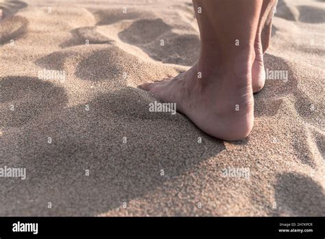 Mature Woman With Barefoot Standing On Sand Stock Photo Alamy