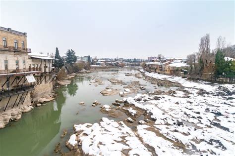 View From White Bridge On Rocky Mountain Rioni River In Kutaisi