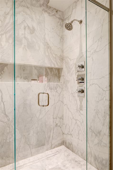 Classic White Marble Shower With Bookmatched Stone Slab Walls And Shampoo Niche Bathroom By